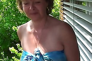 Mature shows her tits and plays there yourselves