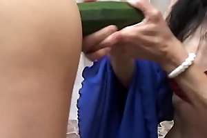 Inferior grown-up milf masturbates will not hear of 's aggravation give a zucchini dimension shellacking him